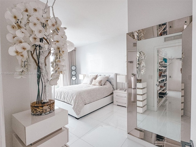 bedroom featuring light tile patterned floors