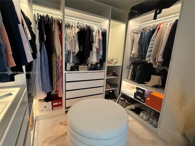 spacious closet featuring light tile patterned floors