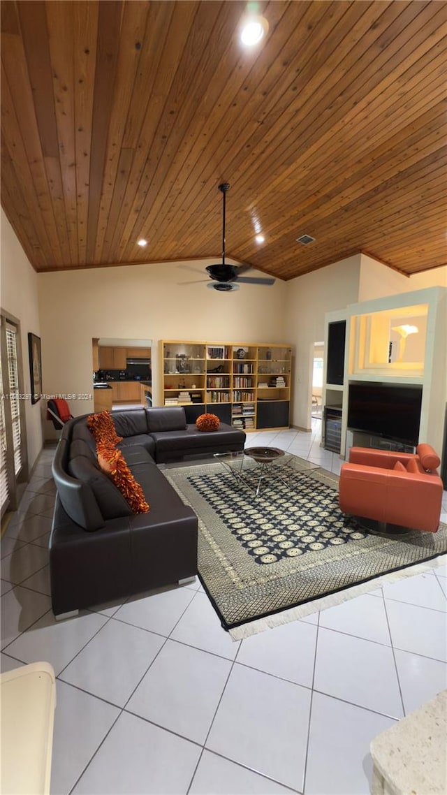 tiled living room featuring lofted ceiling, ceiling fan, built in shelves, and wooden ceiling