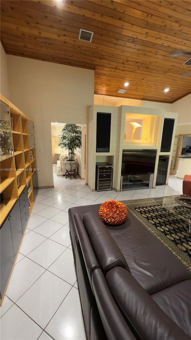 living room featuring wood ceiling and light tile patterned floors