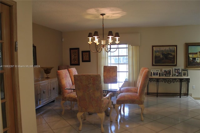 dining room with an inviting chandelier and light tile patterned floors