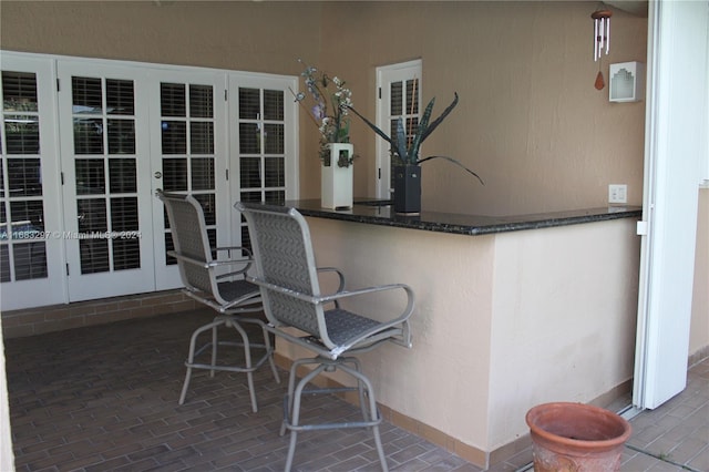 view of patio / terrace featuring french doors and exterior bar