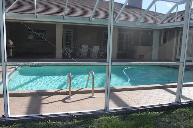 view of swimming pool featuring a patio area