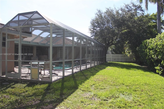 view of yard featuring glass enclosure