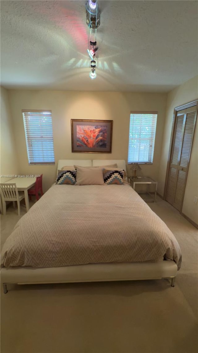 bedroom with carpet floors and ceiling fan