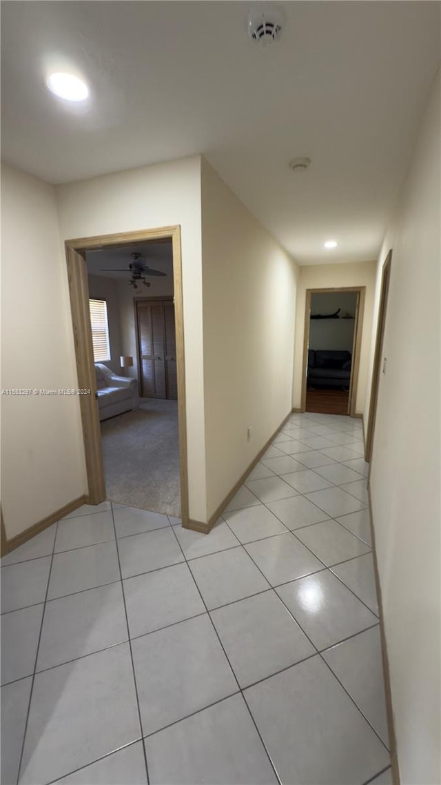 hallway with light tile patterned floors