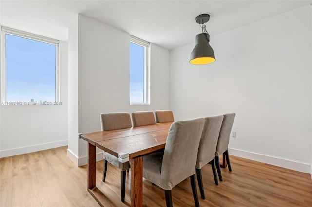 dining area featuring light wood-type flooring