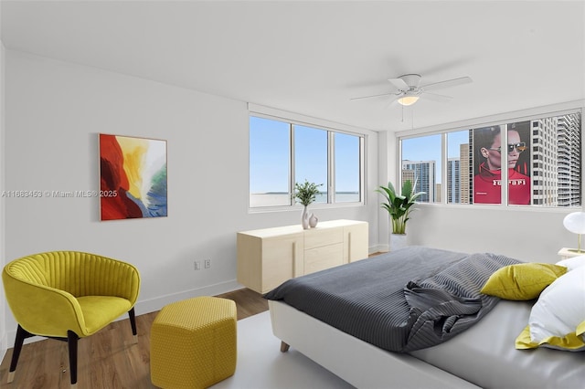 bedroom featuring hardwood / wood-style flooring and ceiling fan