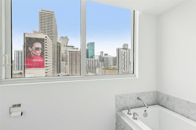 bathroom featuring tiled tub