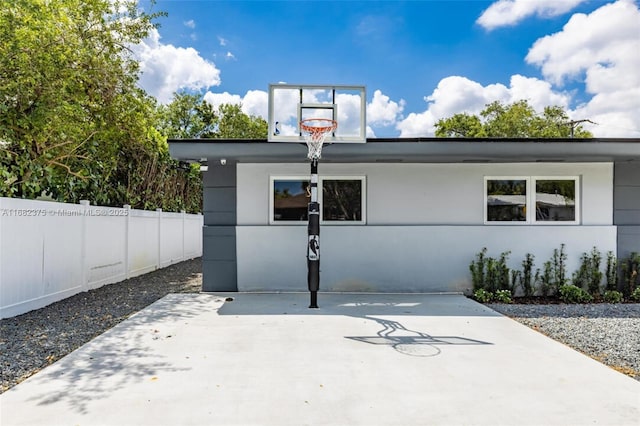 view of sport court with fence