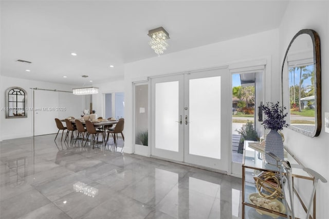 foyer featuring recessed lighting, french doors, and visible vents