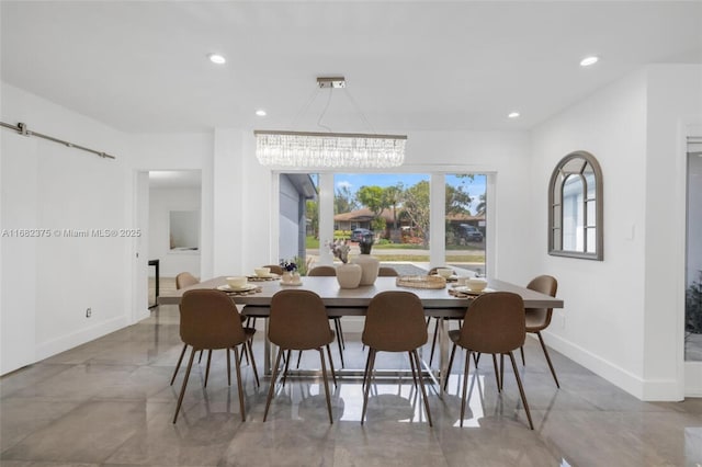 dining room with a barn door, recessed lighting, baseboards, marble finish floor, and an inviting chandelier