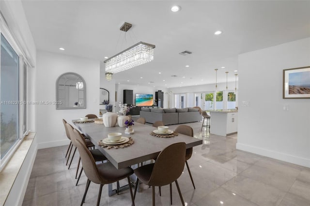 dining area featuring baseboards, visible vents, and recessed lighting