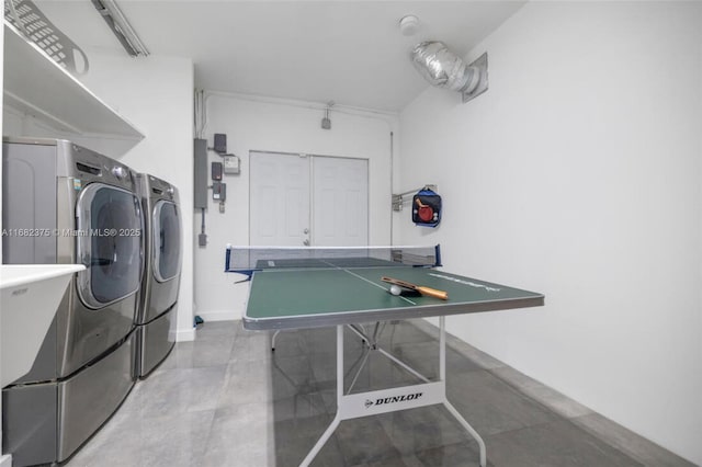 clothes washing area with laundry area and washing machine and clothes dryer