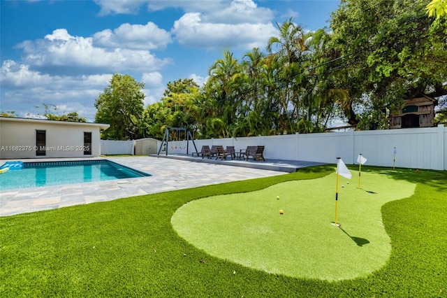 view of swimming pool with a patio, a fenced backyard, and a fenced in pool