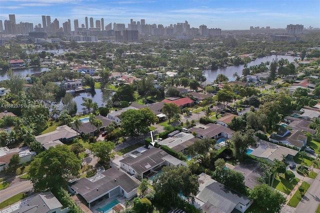 bird's eye view featuring a water view and a city view