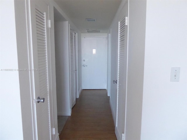 hallway featuring dark hardwood / wood-style floors