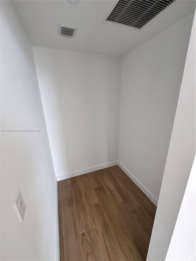 unfurnished room featuring hardwood / wood-style flooring