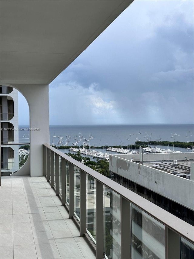 balcony featuring a water view