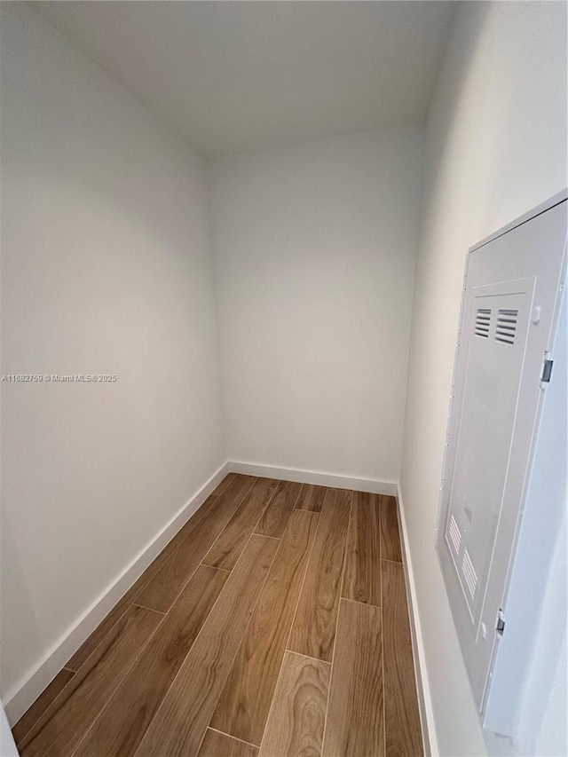 empty room with hardwood / wood-style flooring