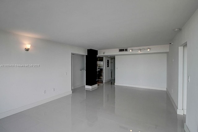 unfurnished living room featuring tile patterned flooring