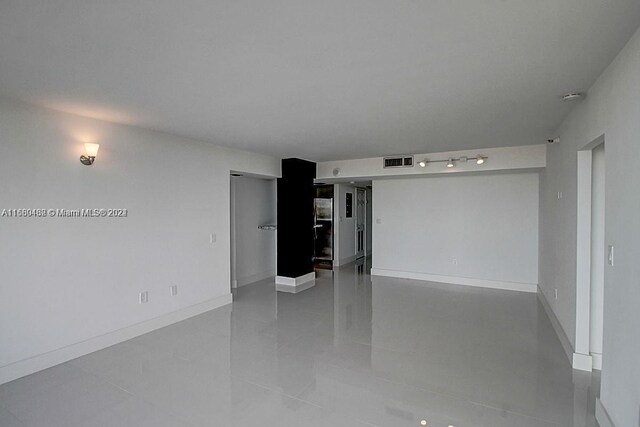 20505 E Country Club Dr Unit 1931, Aventura, FL 33180 - spare room with light tile patterned flooring and baseboards