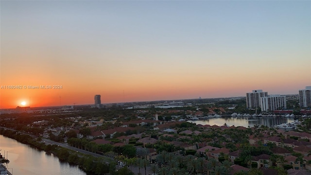 aerial view at dusk with a water view