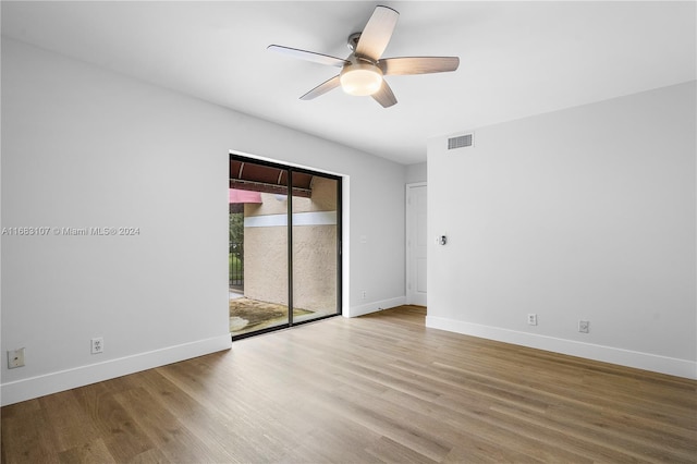 spare room featuring light wood-type flooring and ceiling fan