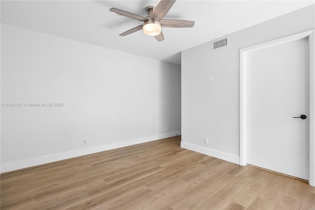 spare room with light hardwood / wood-style flooring and ceiling fan