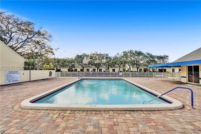 view of swimming pool with a patio