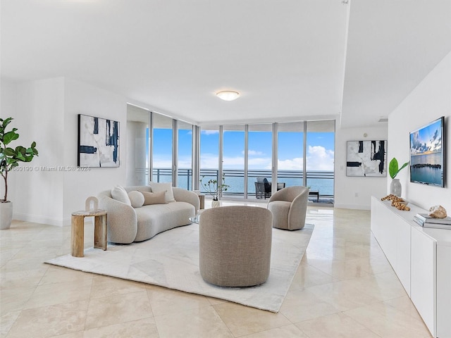 living room featuring a water view and floor to ceiling windows