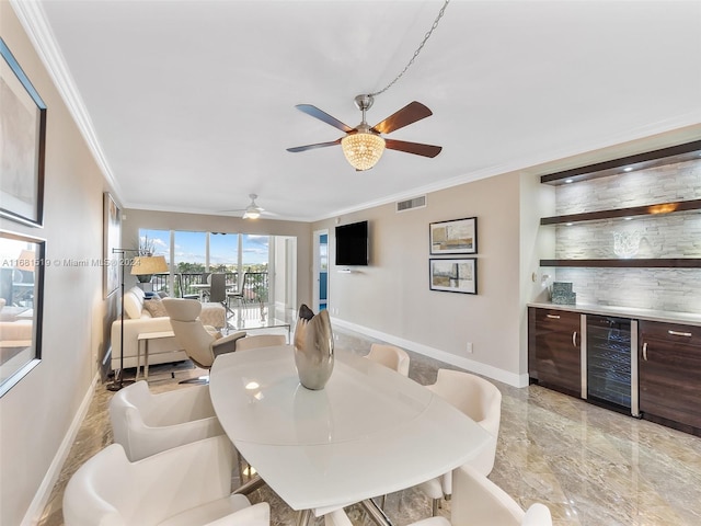 dining area featuring ceiling fan, ornamental molding, and beverage cooler