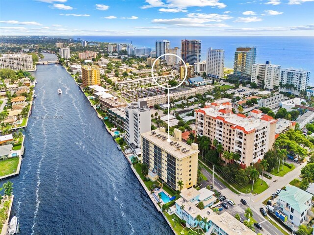 birds eye view of property featuring a water view