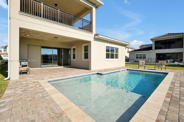 view of swimming pool with a patio