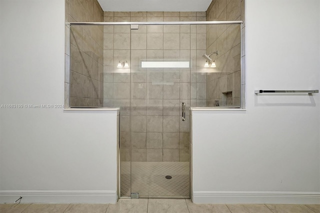 bathroom with walk in shower and tile patterned flooring