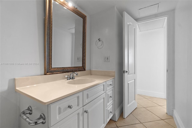 bathroom with vanity, baseboards, tile patterned floors, and visible vents