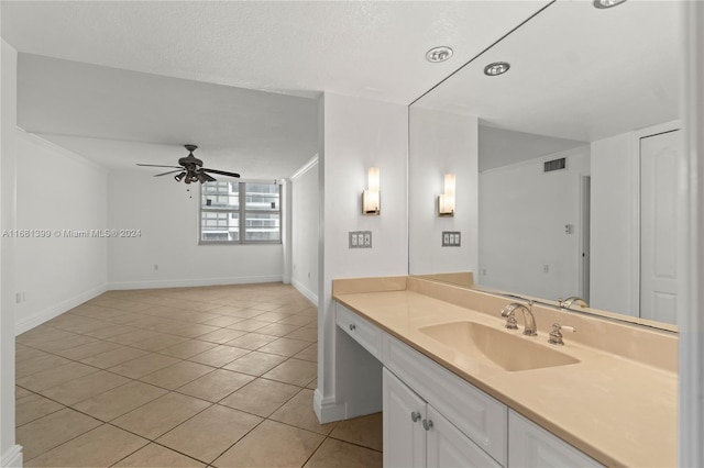 bathroom featuring vanity, ceiling fan, a textured ceiling, and tile patterned flooring