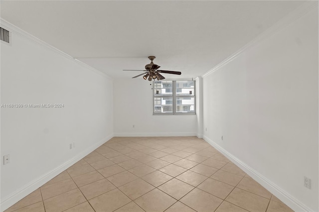 tiled empty room with ornamental molding and ceiling fan