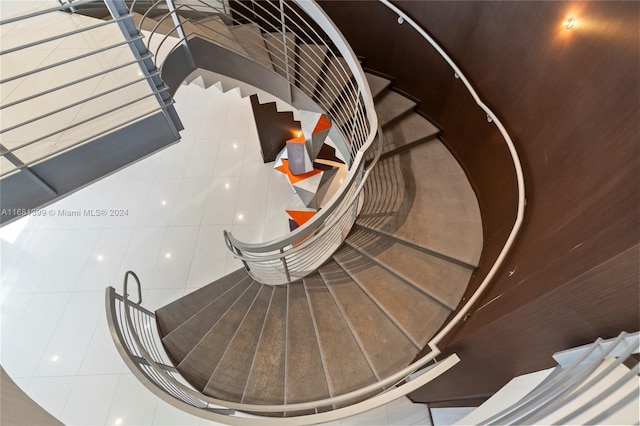 stairway with tile patterned flooring