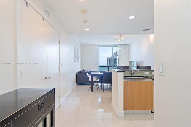 kitchen featuring sink and light tile patterned floors