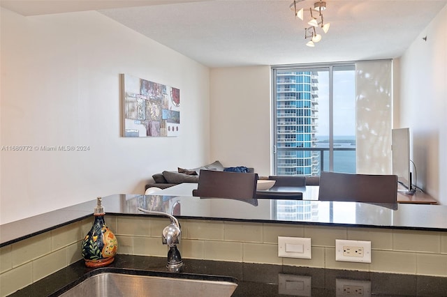 kitchen with a textured ceiling and sink