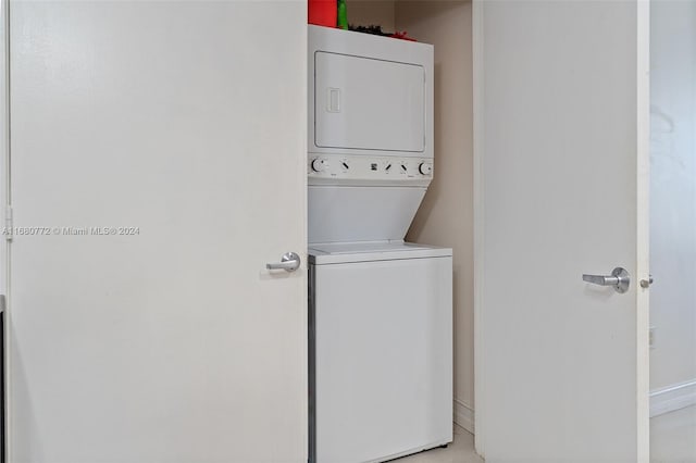 laundry area with stacked washer and clothes dryer