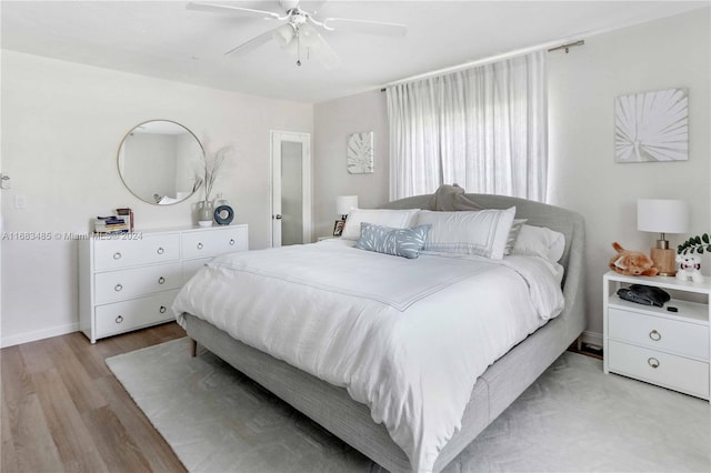 bedroom featuring light hardwood / wood-style flooring and ceiling fan