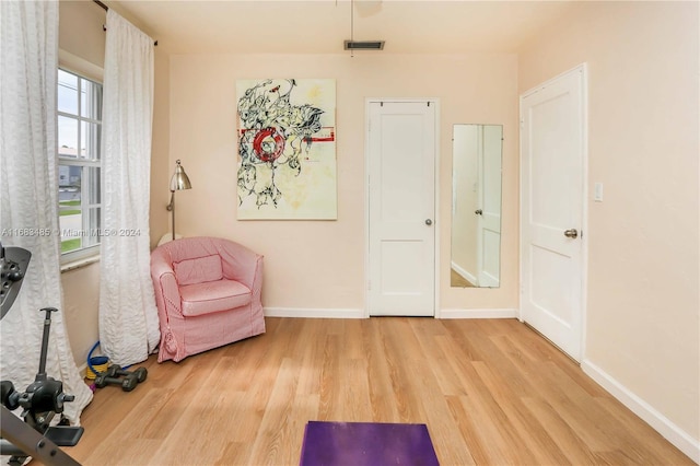 sitting room with light hardwood / wood-style floors