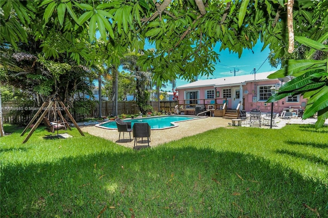 view of pool featuring a patio area and a lawn