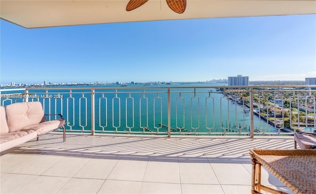 balcony featuring a water view