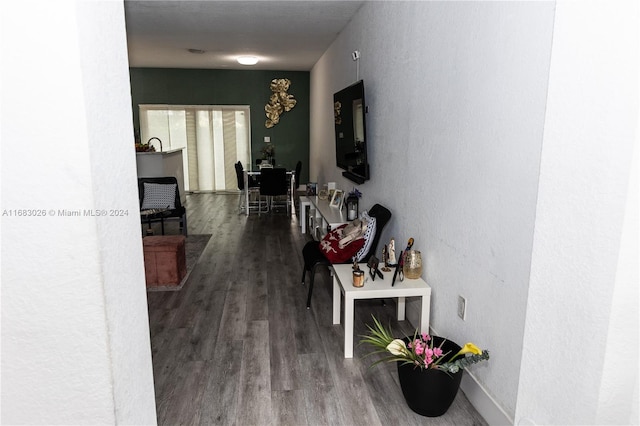 corridor with wood-type flooring