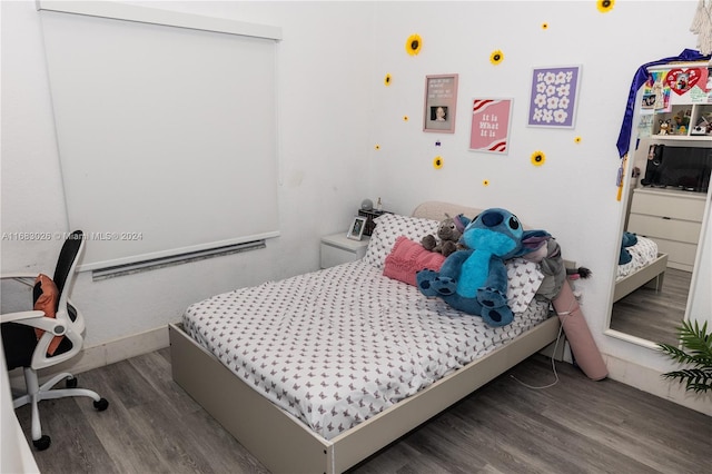 bedroom featuring hardwood / wood-style floors