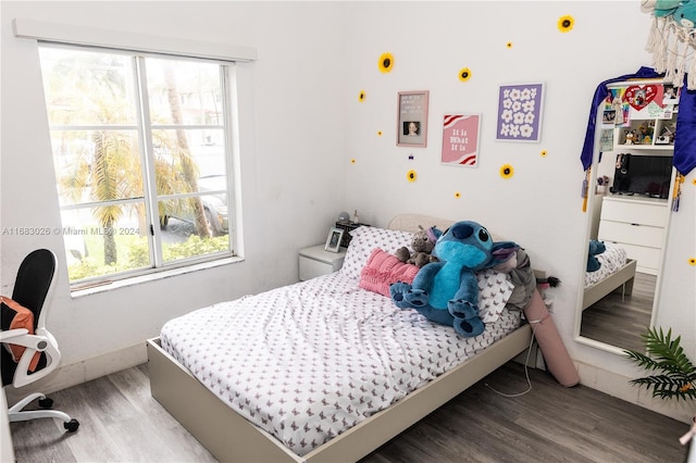 bedroom featuring hardwood / wood-style flooring