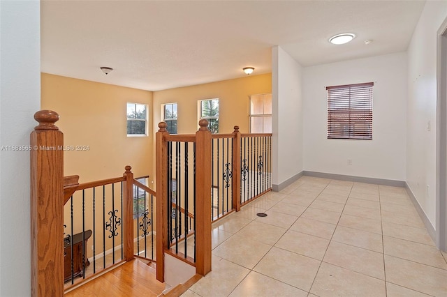 hall with light tile patterned flooring